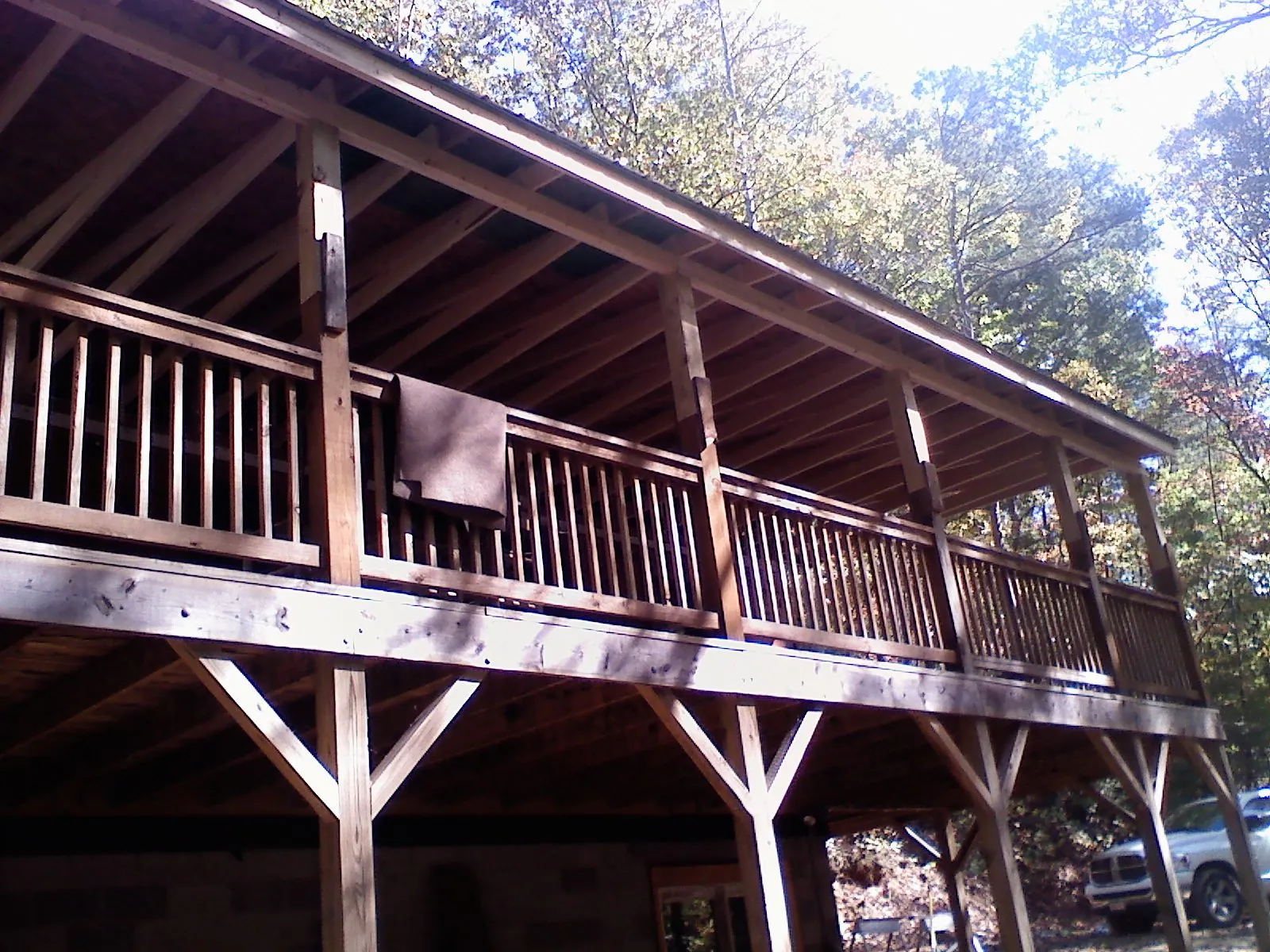 Timber framing under a new elevated porch and deck — Roof Leak Repair in Kechi by Roofing Brothers